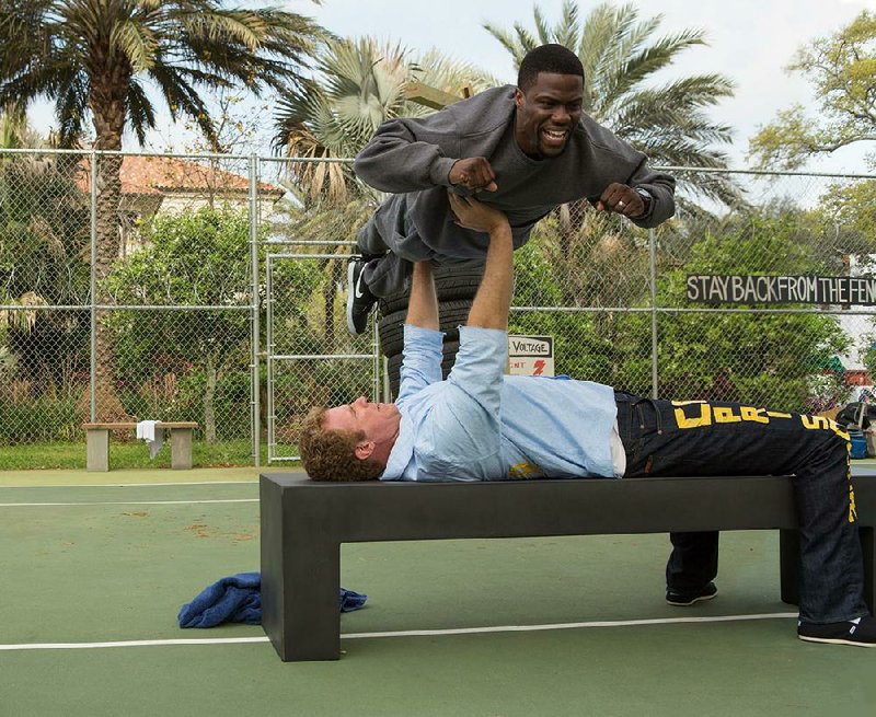 James King (Will Ferrell) works out with his trainer Darnell Lewis (Kevin Hart) in the comedy Get Hard.
