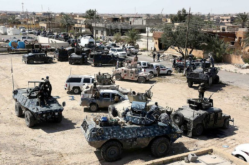 Iraqi security forces prepare Thursday to attack the Islamic State’s positions in Tikrit. 