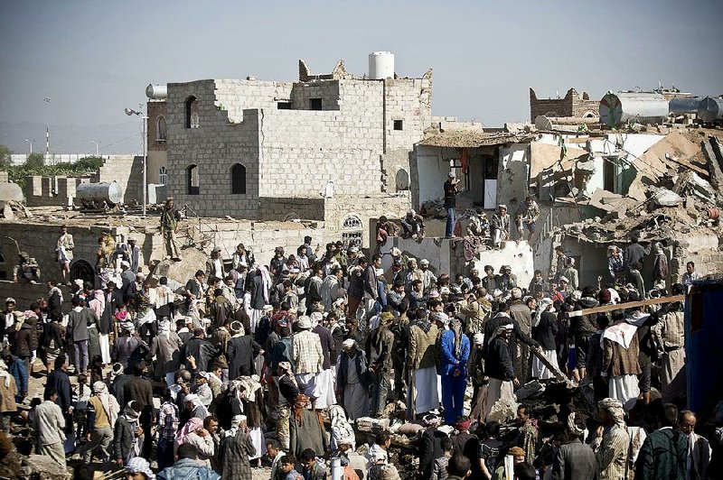 Yemenis search Thursday for survivors in the rubble of houses destroyed by Saudi airstrikes near the airport in Sanaa. At least 18 civilians were reported killed.