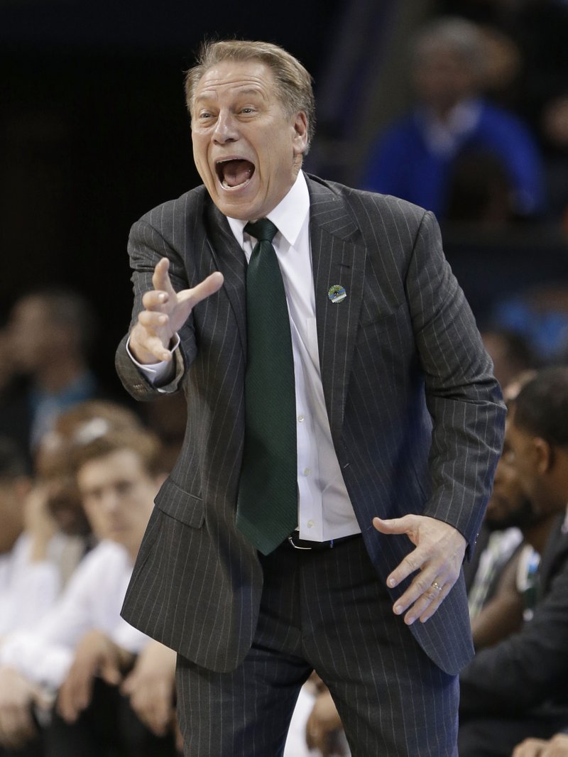 Michigan State head coach Tom Izzo directs his team against Virginia during the second half of an NCAA tournament college basketball game in the Round of 32 in Charlotte, N.C., Sunday, March 22, 2015.
