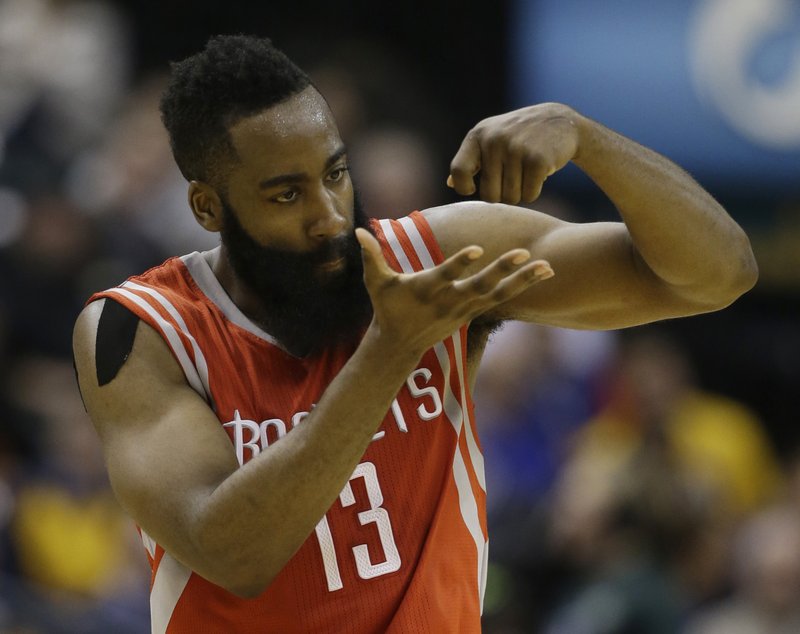 Houston Rockets' James Harden (13) reacts after hitting a basket during the second half of an NBA basketball game against the Indiana Pacers, Monday, March 23, 2015, in Indianapolis. Houston won 110-100.
