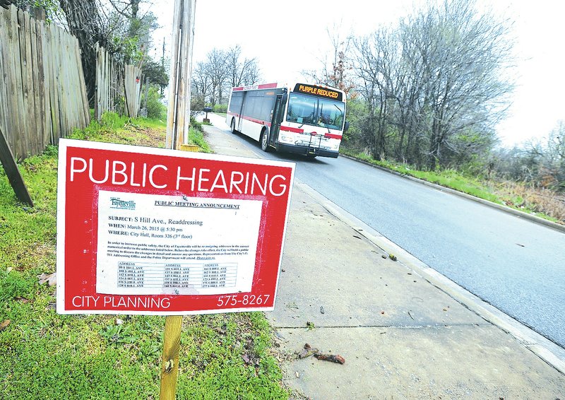 NWA Democrat-Gazette/Michael Woods &#8226; @NWAMICHAELW A public hearing notice posted on Hill Street in Fayetteville gives residents along a section of Hill Street notice their address may soon change. Fayetteville held a public meeting Thursday to discuss address changes on South Hill Avenue. The changes are meant to make it easier for visitors, delivery drivers and emergency responders to find where people live.