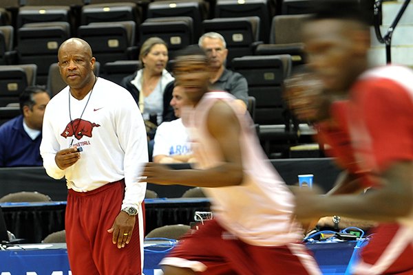 Arkansas coach Mike Anderson watches practice Wednesday, March 18, 2015, at Veterans Memorial Arena in Jacksonville, Fla. 