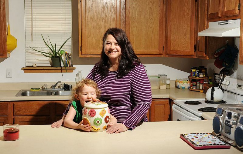 Debi England's favorite place  in her Greenland home is her kitchen that she shares with her 4-year-old granddaughter, Daphine. 