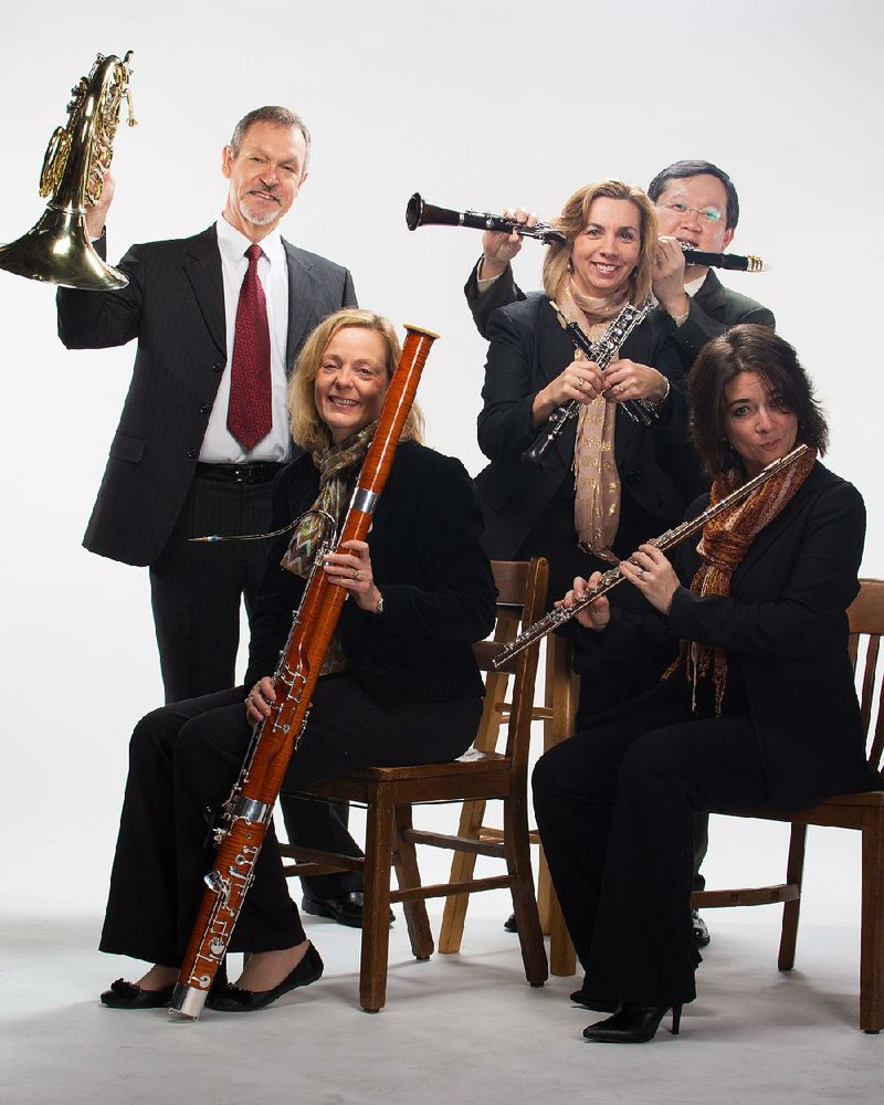The Lyrique Quintette — (from left) University of Arkansas at Fayetteville faculty members Timothy Thompson, French horn; Lia Uribe, bassoon; Theresa Delaplain, oboe; Nophachai Cholthitchanta, clarinet; and Ronda Mains, flute — prepares for its April Fools’ concert.