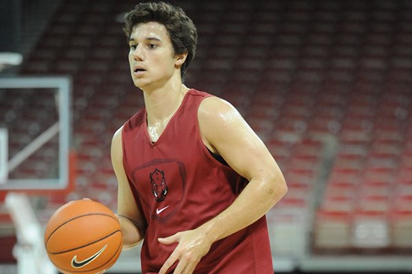 Arkansas' Dusty Hannahs goes through drills during practice Monday, Oct. 27, 2014, at Bud Walton Arena in Fayetteville.