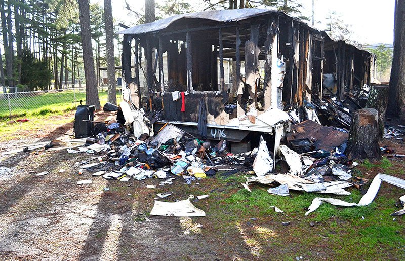 The Sentinel-Record/Caitlin LaFarlette FATAL FIRE: The charred, gutted remains of a mobile home at 318 Skyview Terrace were all that were left Friday morning after a fire erupted inside around 10:30 p.m. Thursday. One resident, Junior Otwell, 68, died from injuries he received, while his wife and son reportedly escaped with the help of a neighbor.