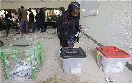 A woman displaced by Islamist militant attacks casts her vote during the presidential and National Assembly elections in Yola, Nigeria Saturday, March 28, 2015. Nigerians went to the polls Saturday in presidential elections which analysts say will be the most tightly contested in the history of Africa's richest nation and its largest democracy.