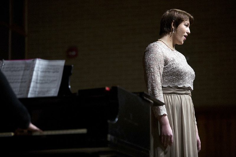 Tressa Tiner, accompanied by her mother Janine Tiner, sings “Hello, Margaret, It’s You” from the opera The Telephone for judges Saturday at the University of Central Arkansas in Conway. Tiner is from North Little Rock and is a student at the University of Memphis.