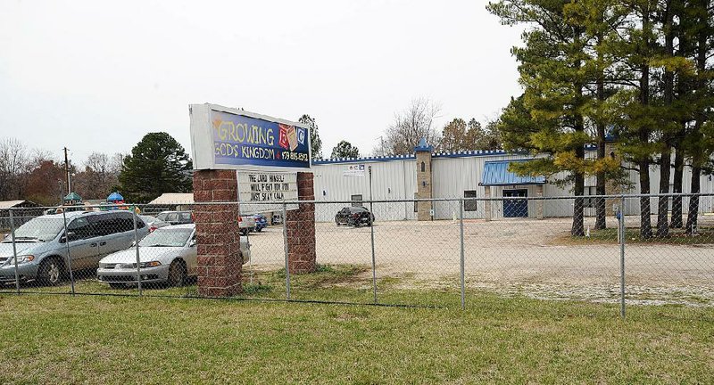 A sign outside the Growing God’s Kingdom preschool in West Fork on March 20 proclaims: “The Lord Himself will fight for you. Just stay calm.” 