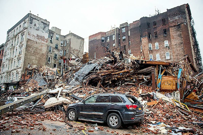 Preliminary evidence gathered after Thursday’s explosion leveled these three apartment buildings in New York City point to work underway on plumbing and gas lines. 
