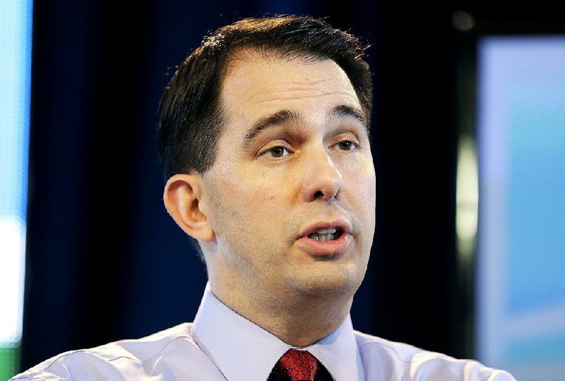 In this March 7, 2015 file photo, Wisconsin Gov. Scott Walker speaks in Des Moines, Iowa. It’s become even clearer thanks to Wisconsin Gov. Scott Walker: Immigration is the banana peel of 2016 Republican presidential politics. 