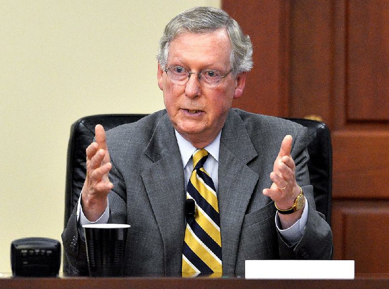 In this Aug. 20, 2014, file photo, Senate Minority Leader Mitch McConnell of Ky. speaks in Louisville, Ky. 
