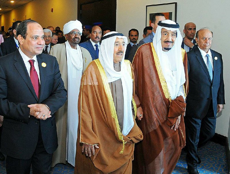 Egyptian President Abdel-Fattah el-Sissi (foreground, from left), Sudanese President Omar al-Bashar, Saudi King Salman and Yemeni President Abdel Rabbo Mansour Hadi gather with other leaders for an Arab summit Saturday in Sharm el-Sheikh, Egypt. 