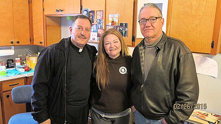 Submitted photo HELPING MOTHERS-TO-BE: Knights of Columbus Council 6419 donated $8,400 to Change Point to help support volunteer nurse Kelly Jo Whitlock, center, in her work. With her are the Rev. George Sanders and David Myers, KoC programs chairman.