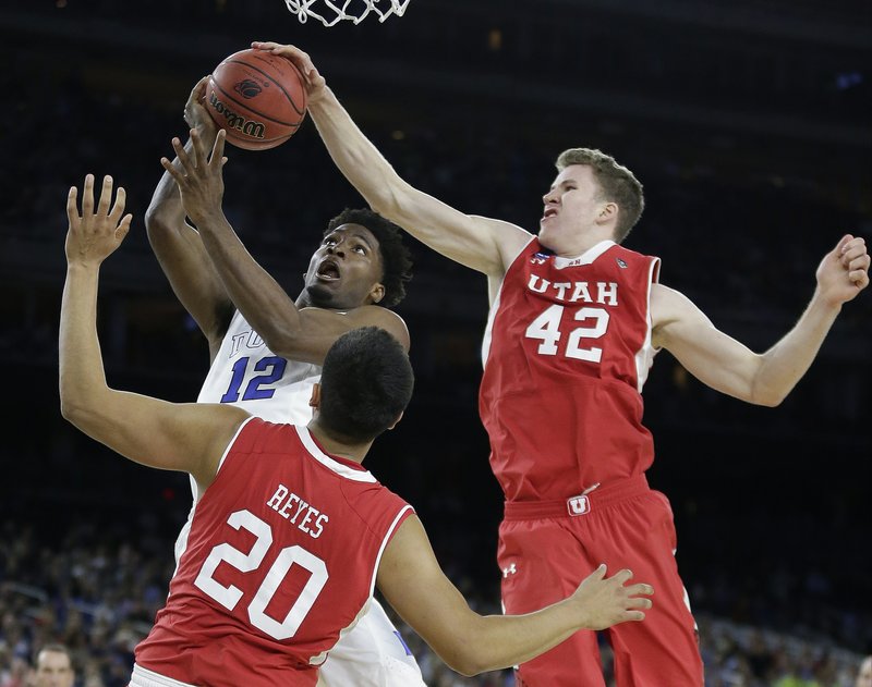 The Associated Press STOPPED SHORT: Utah's Jakob Poeltl, right, blocks a shot by Duke freshman Justise Winslow during the second half a South Region semifinal Friday night in Houston. Winslow's 21 points and 10 rebounds led top-seeded Duke to a 63-57 win. The Blue Devils play No. 2 Gonzaga today for a trip to the Final Four.