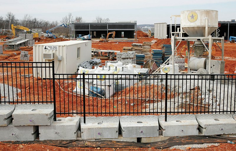 NWA Democrat-Gazette/DAVID GOTTSCHALK - 2/25/15 - Construction of a Whole Foods Market and additional buildings continues Feb. 25 on North College Avenue just south of Millsap Road in Fayetteville. City planners said the number of commercial building permits issued by the area&#8217;s four largest cities rose 37 percent between 2013 and 2014.