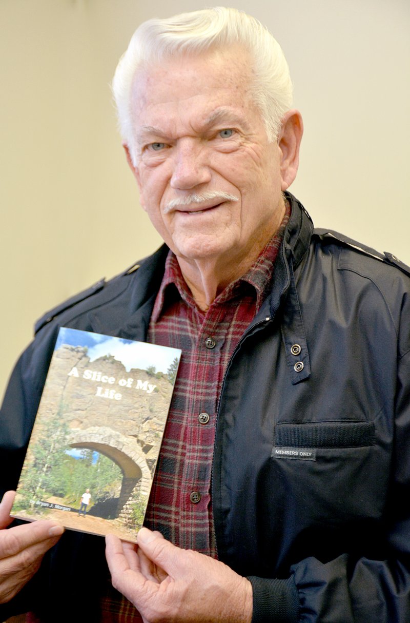 Janelle Jessen/Siloam Sunday Bryan Morgan sells his book &#8220;A Slice of My Life&#8221; at Siloam Springs Senior Activity Center. Morgan&#8217;s poetry-based book includes three sections: religious, serious and humorous. All proceeds from Morgan&#8217;s book sales go directly to charity.