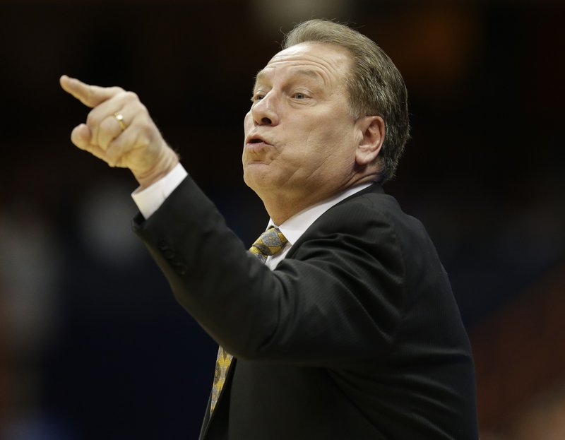 Michigan State coach Tom Izzo calls out to his team during the first half of a regional semifinal against the Oklahoma in the NCAA men's college basketball tournament Friday, March 27, 2015, in Syracuse, N.Y.