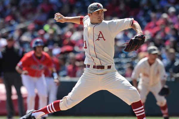 Starter Keaton McKinney of Arkansas delivers a pitch against Mississippi during the second inning Saturday, March 28, 2015, at Baum Stadium in Fayetteville.