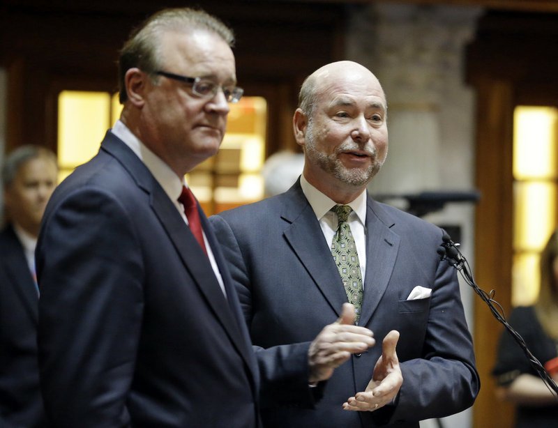 Indiana Senate President Pro Tem David Long, left, (R-Fort Wayne) and House Speaker Brian C. Bosma (R-Indianapolis) discuss their plans for clarifying the Indiana Religious Freedom Restoration Act during a press conference at the Statehouse in Indianapolis, Monday, March 30, 2015. Republican legislative leaders in Indiana state say they are working on adding language to a new state law to make it clear that it doesn't allow discrimination against gays and lesbians. 