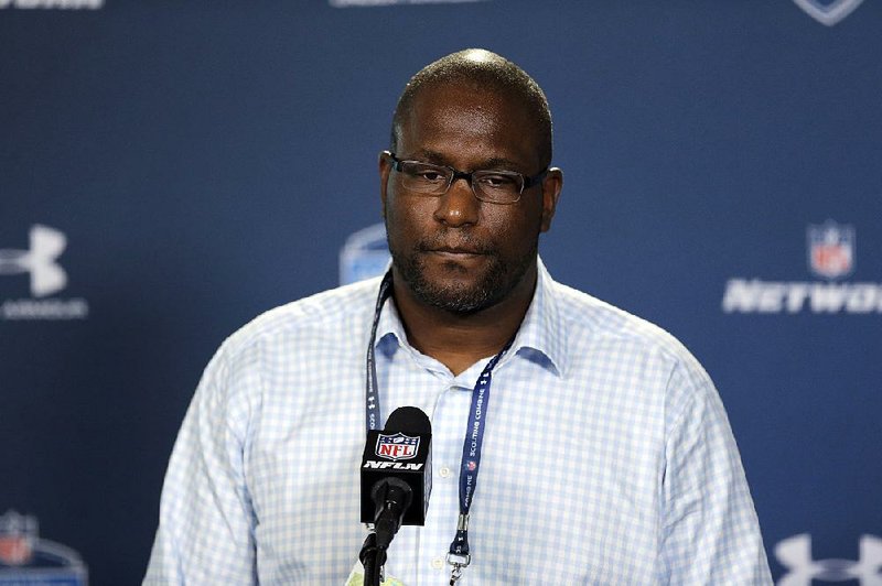 FILE - In this Feb. 19, 2015, file photo, Cleveland Browns general manager Ray Farmer listens to a question during a news conference at the NFL football scouting combine in Indianapolis. The NFL has suspended Browns general manager Ray Farmer for four games for sending text messages to the sideline last season during games.  Farmer has acknowledged sending the messages, which is prohibited under league rules. The league's punishment handed down on Monday, March 30, 2015,  includes a $250,000 fine on the Browns.  (AP Photo/David J. Phillip, File)