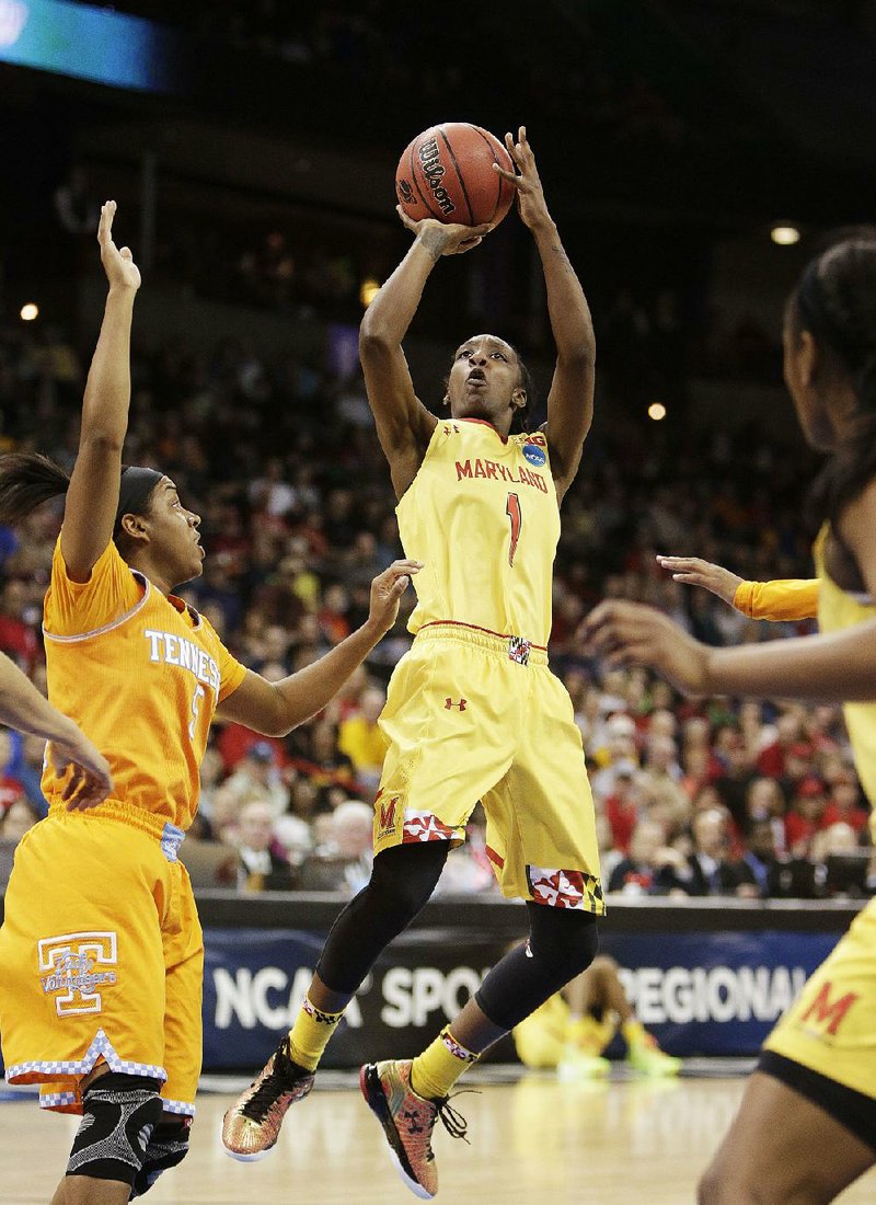Maryland's Laurin Mincy (1) shoots against Tennessee's Ariel Massengale (5) during a women's college basketball regional final game in the NCAA tournament, Monday, March 30, 2015, in Spokane, Wash. (AP Photo/Young Kwak)