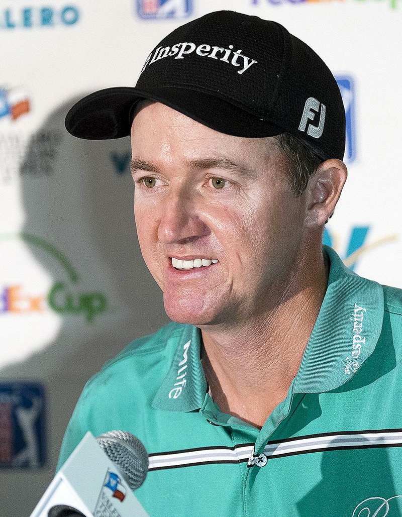 Jimmy Walker speaks during an interview after the fourth and final round of the Valero Texas Open golf tournament, Sunday, March 29, 2015, in San Antonio. Walker won the tournament. (AP Photo/Darren Abate)