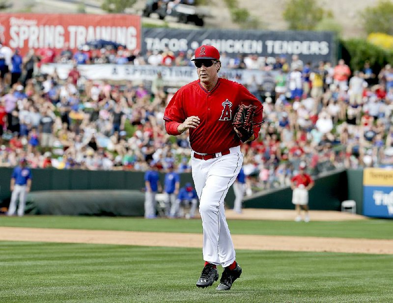 Actor Will Ferrell plays for Los Angeles Angels during a spring training baseball exhibition game against the Chicago Cubs in Tempe, Ariz., on Thursday, March 12, 2015. The comedian plans to play every position while making appearances at five Arizona spring training games on Thursday. (AP Photo/Chris Carlson)