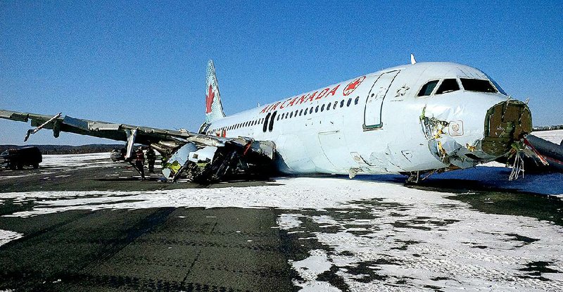 This photo provided by the Transportation Safety Board of Canada shows a Air Canada Airbus A-320 at Halifax International Airport after making an "abrupt" landing and skidding off the runway in bad weather early Sunday, March 29, 2015. Officials said 23 people were taken to a hospital for observation and treatment of minor injuries, none of which were considered life threatening. (AP Photo/The Transportation Safety Board of Canada)