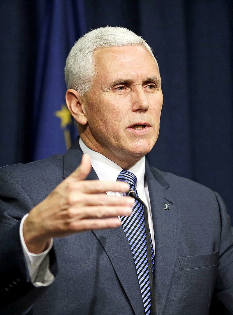 Indiana Gov. Mike Pence holds a news conference at the Statehouse in Indianapolis, Thursday, March 26, 2015. Pence has declared a public health emergency in response to the HIV epidemic in Scott County.  Seventy two cases of HIV have been confirmed in the southern Indiana county. (AP Photo/Michael Conroy)