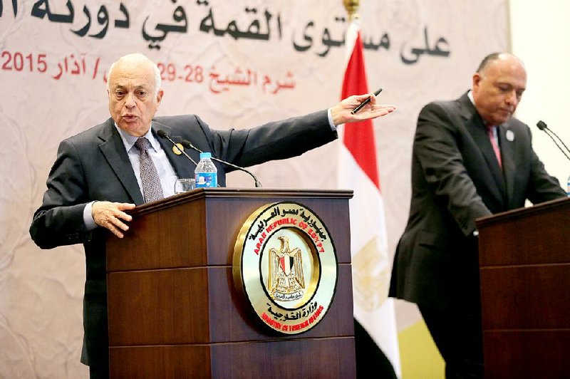 Arab League Secretary-General Nabil Elaraby, left, and Egyptian Foreign Minister Sameh Shukri give a press conference at the conclusion of an Arab summit meeting in Sharm el-Sheikh, South Sinai, Egypt, Sunday, March 29, 2015. (AP Photo/Thomas Hartwell)