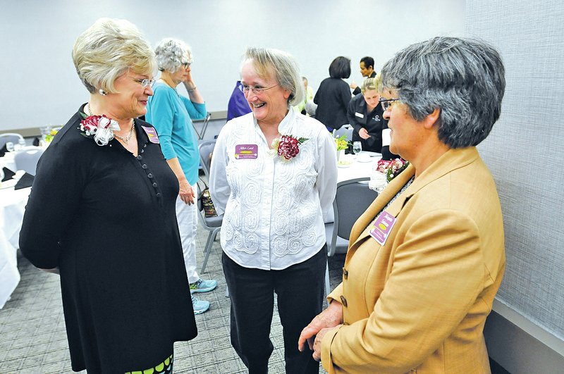 NWA Democrat-Gazette/J.T. WAMPLER Kathy Grisham (from left), Allyn Lord and Margarita Solorzano, along with Rita Miller (not pictured), were honored Monday at the 17th Annual Women&#8217;s History Month Banquet held in Fayetteville.