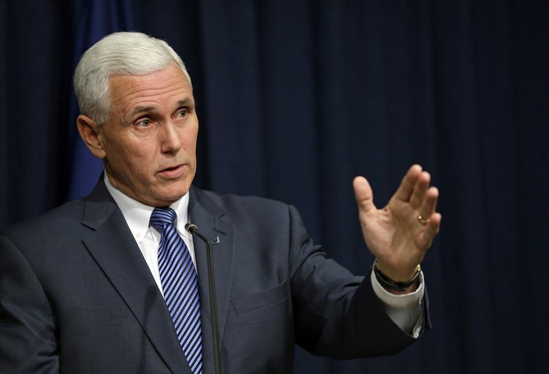 Indiana Gov. Mike Pence holds a news conference at the Statehouse in Indianapolis, Thursday, March 26, 2015. Pence has signed into law a religious objections bill that some convention organizers and business leaders have opposed amid concern it could allow discrimination against gay people.