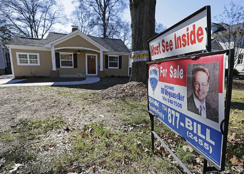 A house for sale in Charlotte, N.C., is shown in January. U.S. home prices rose at a steady pace in January, a report released Tuesday said. 