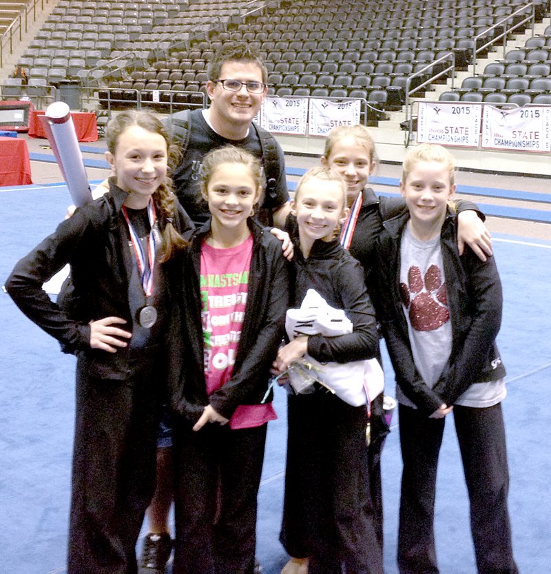 Photo submitted Right: Upward Bound Gymnastics students who finished in the top three in an event at the USA Gymnastics State Championship were, from left, Kate Shaw, Vanessa Williams, Cailee Johnson, Maddison Boehmer, and Emma Norberg, with Coach Nate Patterson. Not pictured is Kendra Wilkie.
