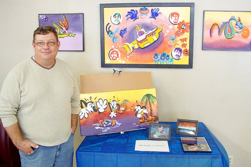 Photo by Randy Moll Known by some for his sidewalk chalk art, which has been featured in the Eagle Observer, local artist Michael S. Kelly also paints with acrylics and displayed a good number of his art pieces at a Saturday open house inside the Gallery Cafe in Decatur.