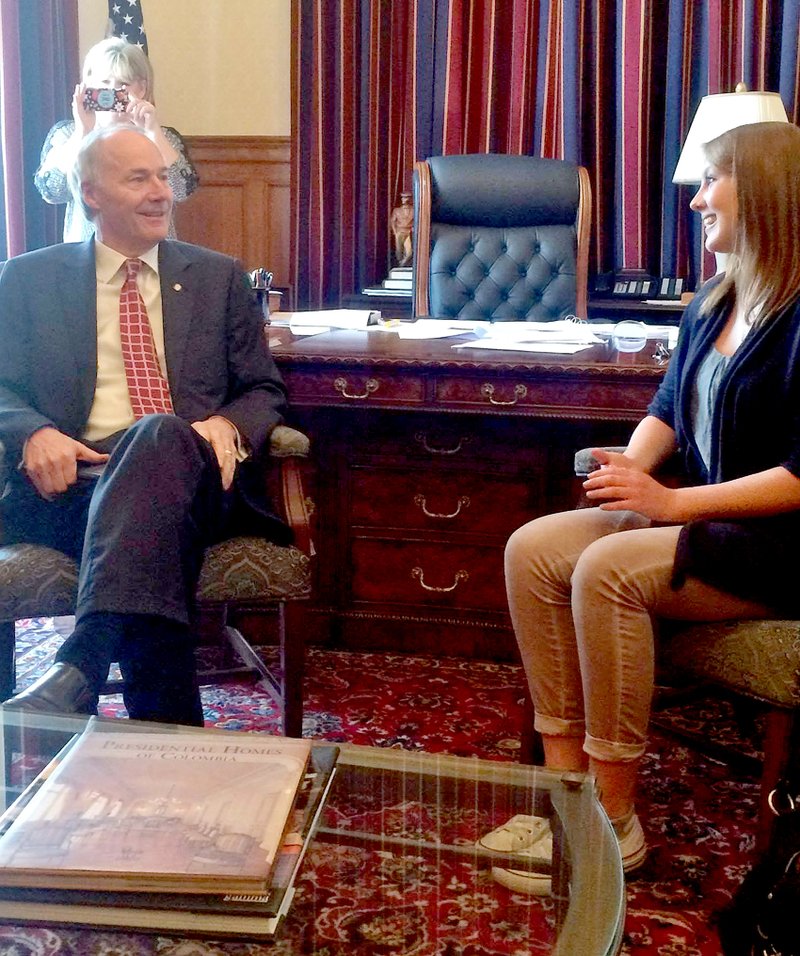 Submitted Photo Arkansas Governor Asa Hutchinson visits with Julia Gemacher, a foreign echange student from Germany who is attending Gravette High School.