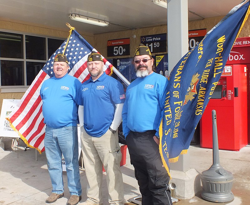 TIMES photograph by Annette Beard Members of the Veterans of Foreign Wars &#8212; Jerry Burton, Chris Snow and Rich Zuber &#8212; collected worn out flags Saturday in front of the Neighborhood Market and received close to $600 in donations for the Veterans Memorial planned for downtown Pea Ridge. Another VFW member collected at White Oak Station Saturday, too.