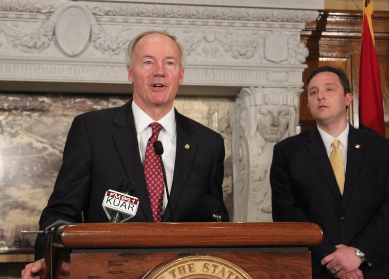 Gov. Asa Hutchinson on Wednesday, April 1, 2015, calls for changes to House Bill 1228 while House Speaker Jeremy Gillam looks on, at a news conference at the state Capitol in Little Rock.