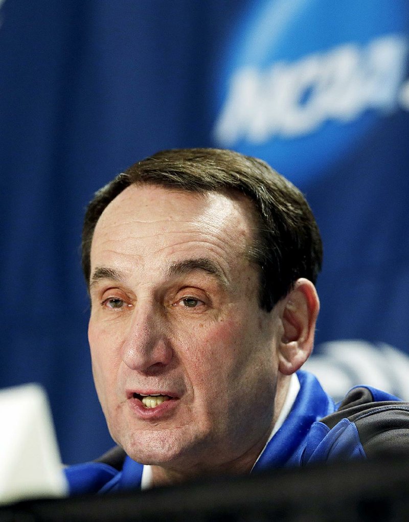Duke head coach Mike Krzyzewski answers questions during a news conference for a college basketball regional final at the NCAA Tournament Saturday, March 28, 2015, in Houston. 