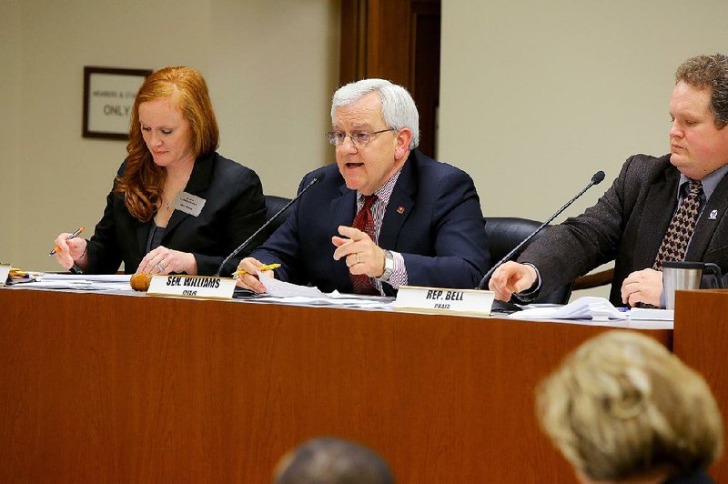 Sen. Eddie Joe Williams (center) brings up in a joint committee Wednesday a proposal for a constitutional amendment allowing a governor to retain his powers when out of state.