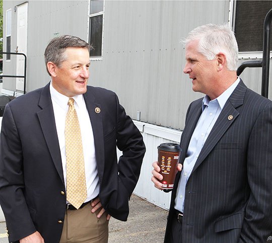 The Sentinel-Record/Richard Rasmussen UPS VISIT: U.S. Rep. Bruce Westerman, R-District 4, left, speaks with UPS Operations Manager Dave Eusanio, of Little Rock, Wednesday morning before speaking with UPS employees at the company's Hot Springs distribution center.