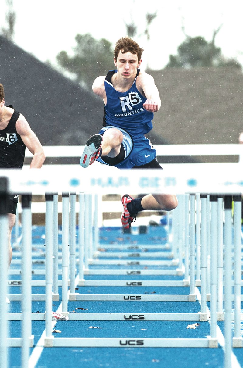  NWA Democrat-Gazette/ANTHONY REYES &#8226; @NWATONYR Tony Roller of Rogers High competes in the hurdles Thursday during the Springdale Invitational Track Meet at Springdale Har-Ber track in Springdale.