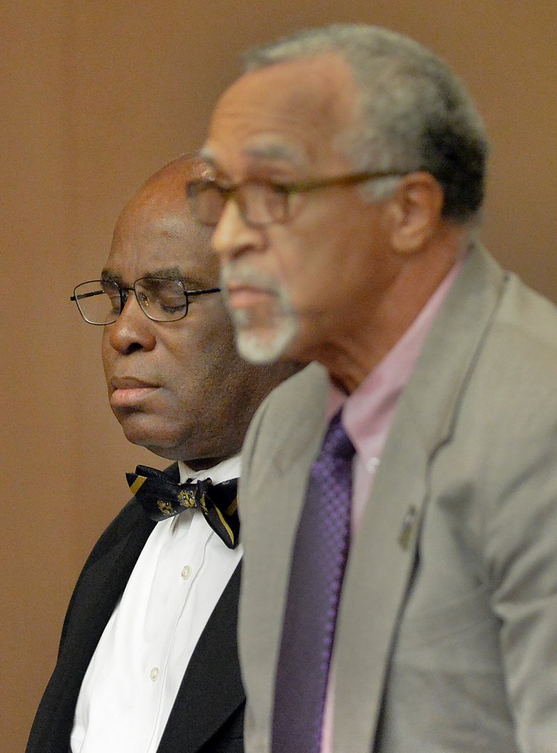 Donald Bullock, left, former Atlanta Public Schools Usher-Collier Heights Elementary testing coordinator, reacts as a jury finds him guilty in the Atlanta Public Schools test-cheating trial, Wednesday, April 1, 2015, in Atlanta. Bullock and 10 other former Atlanta Public Schools educators accused of participating in a test cheating conspiracy that drew nationwide attention were convicted Wednesday of racketeering charges. 