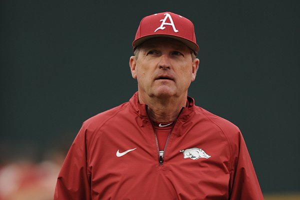 Arkansas coach Dave Van Horn walks to the dugout as he players prepare for LSU Thursday, March 19, 2015, at Baum Stadium in Fayetteville.