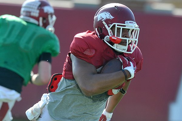 Arkansas running back Jonathan Williams carries the ball during a practice Tuesday, March 31, 2015, in Fayetteville. 