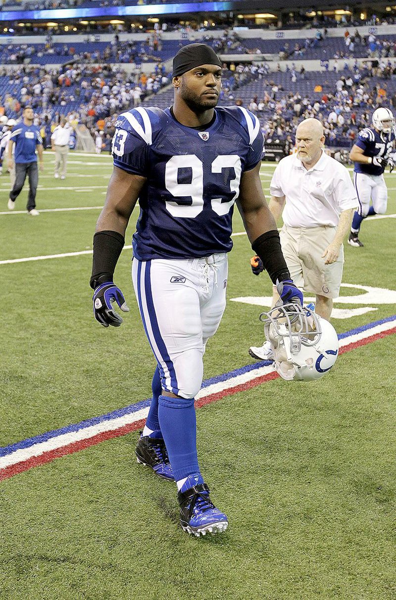 Indianapolis Colts defensive end Dwight Freeney leaves the field following an NFL football game against the Cleveland Browns in Indianapolis, Sunday, Sept. 18, 2011. The Browns won 27-19. (AP Photo/Darron Cummings)