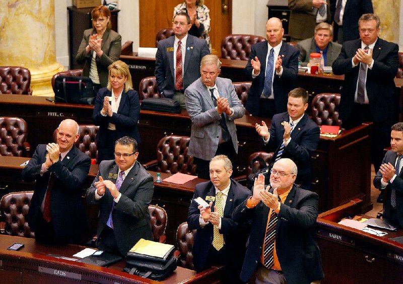 4/2/15
Arkansas Democrat-Gazette/STEPHEN B. THORNTON
House members applause Speaker of the House Jeremy Gillam at the close of their session Thursday at the state capitol Thursday in Little Rock.