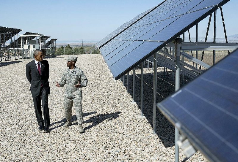 President Barack Obama tours a solar array Friday with Col. Ronald Jolly at Hill Air Force Base in Utah before speaking about clean energy and jobs. 